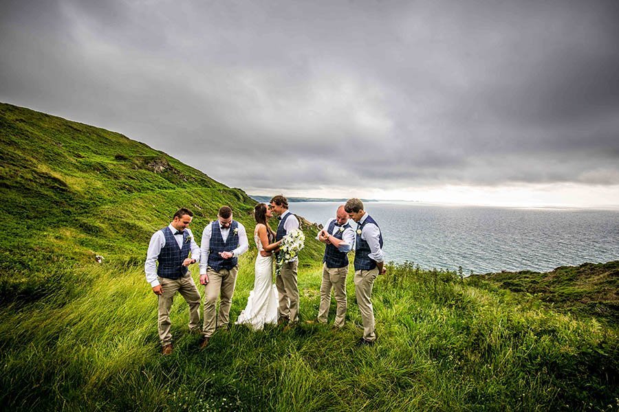 bridal party on the coast path at Tregardock cornwall