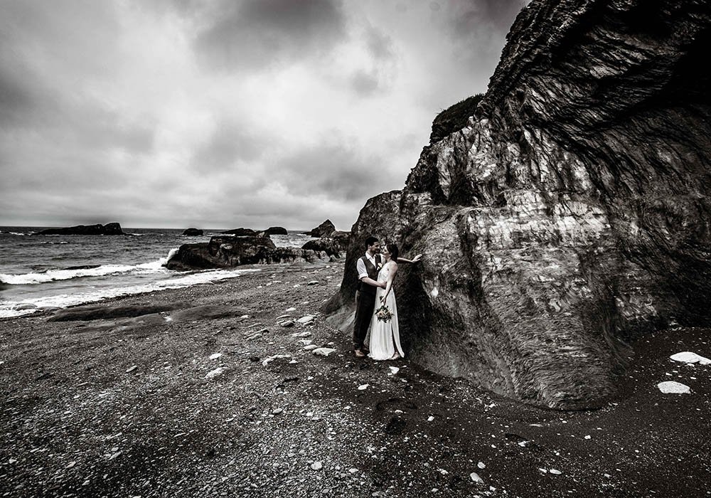 Bride and groom on the beach at Tunnels Beaches Devon wedding venue