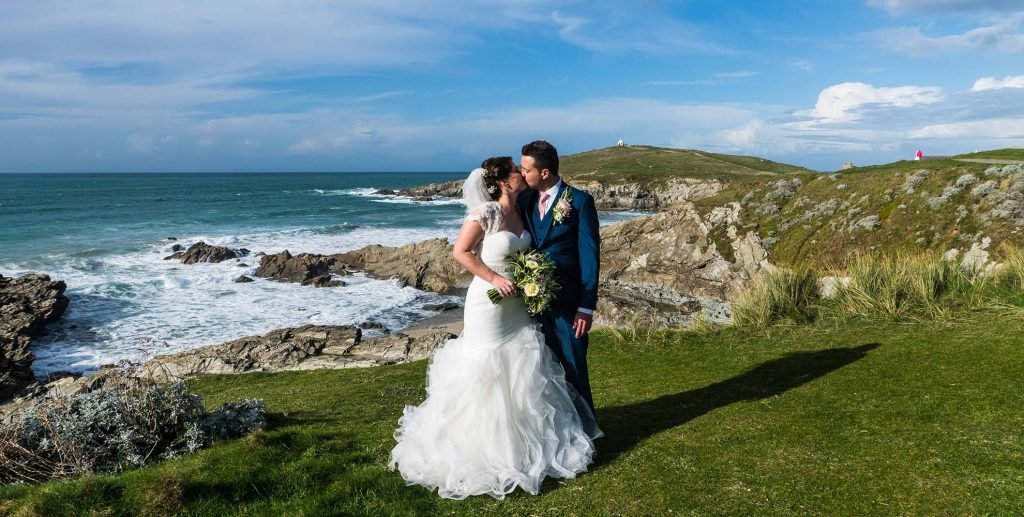 bride and groom on the coast path at The Headland Hotel Newqauy wedding