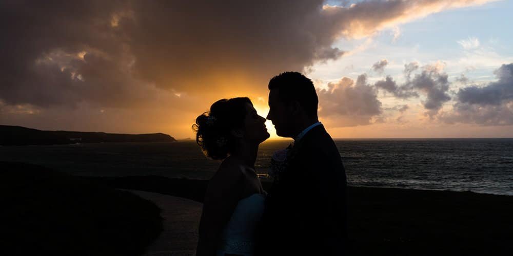 bride and groom silhouette shot at sunset