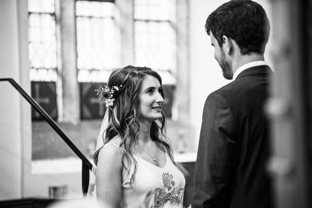 bride and groom saying vows church ceremony