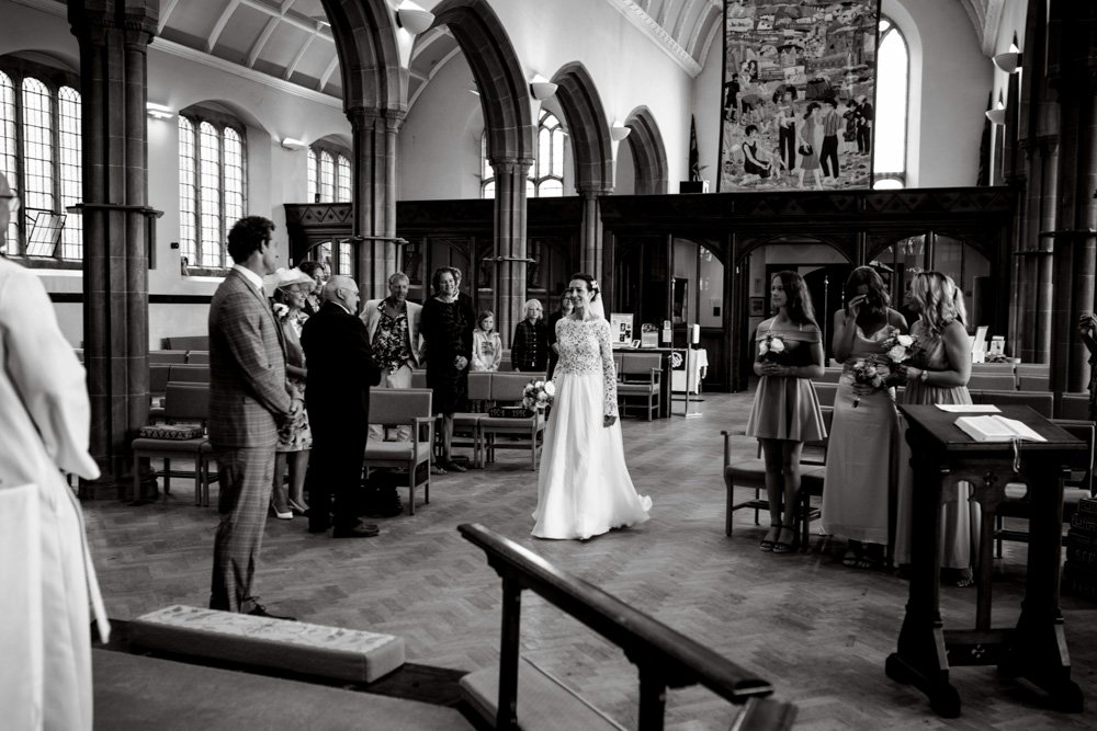 bride arriving for the wedding ceremony in church