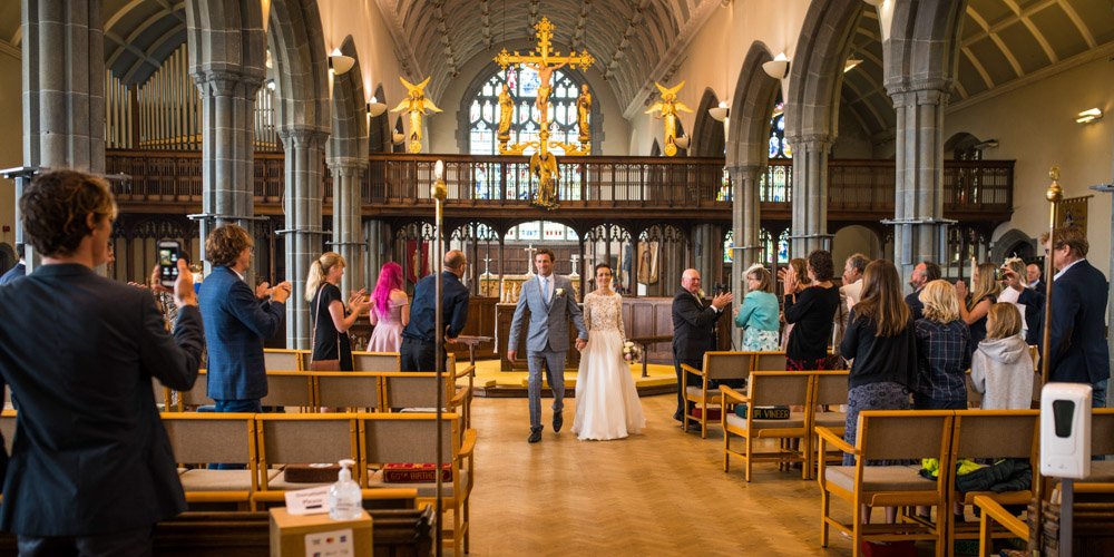 bride and groom leaving the wedding ceremony in church