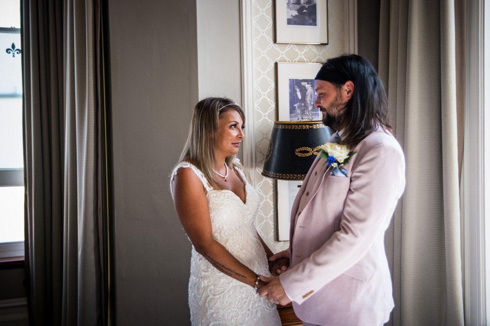 bride and groom holding hands at the wedding ceremony