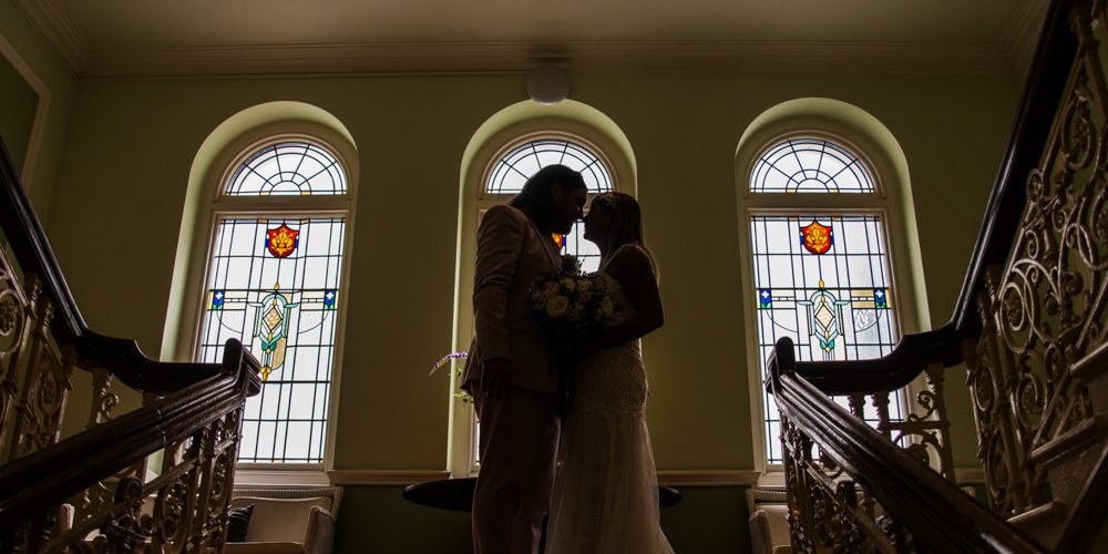 bride and groom silhouette shot on the stairs