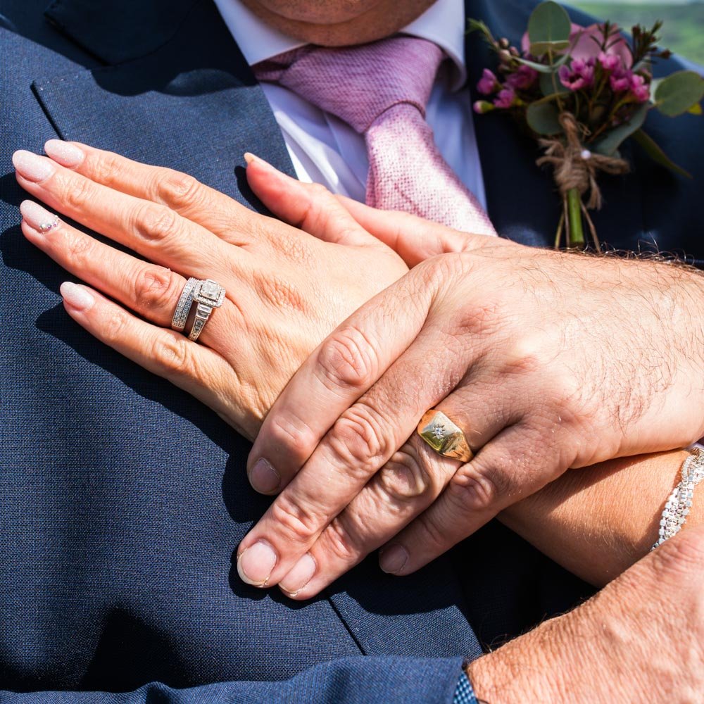 wedding rings on hands