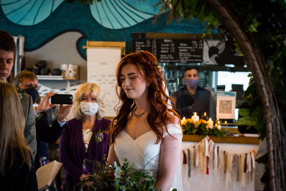 bride praying during the service