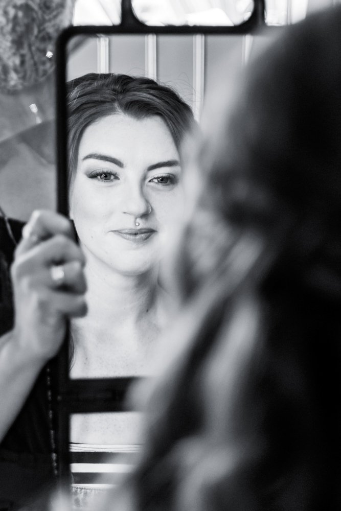 bride looking in the mirror B&W