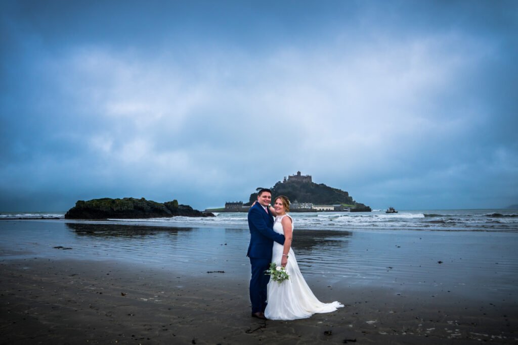 bride and groom on the beach at St Michaels Mount cornwall