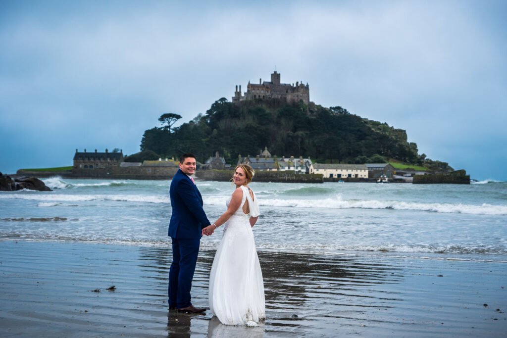 bride and groom on the beach at St Michaels Mount cornwall