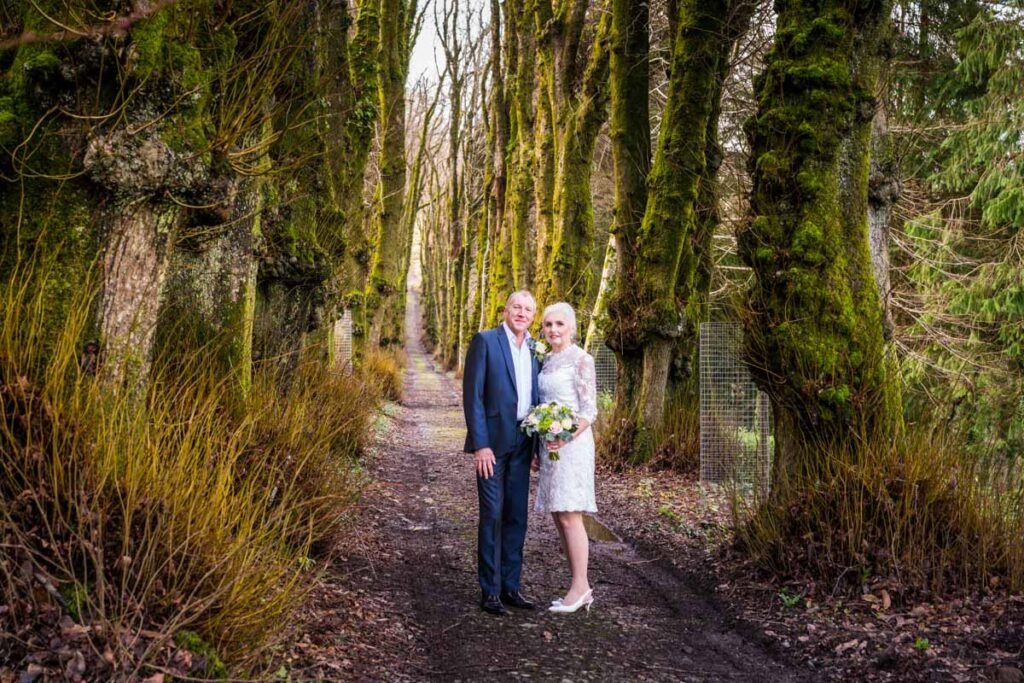 bride and groom in the woods at Pentillie Castle