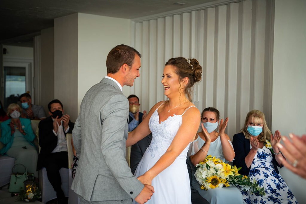 Bride and groom during the wedding ceremony at Hannafore Point Hotel in Looe Cornwall