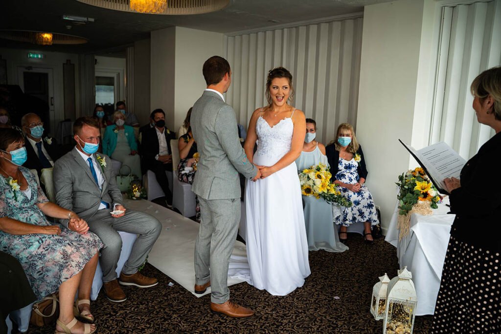 Bride and groom during the wedding ceremony at Hannafore Point Hotel in Looe Cornwall