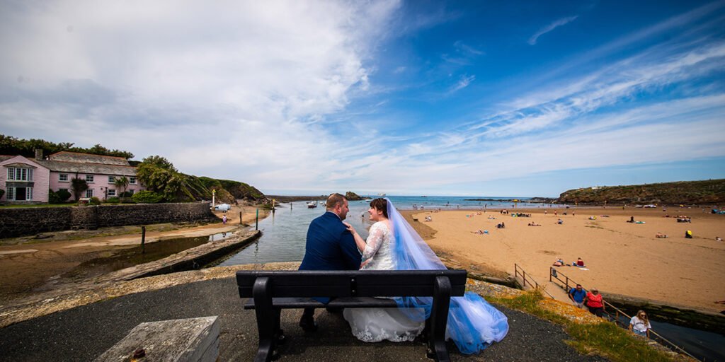 Bride and Groom overlooking crooklets beach in bude Cornwall cornwall
