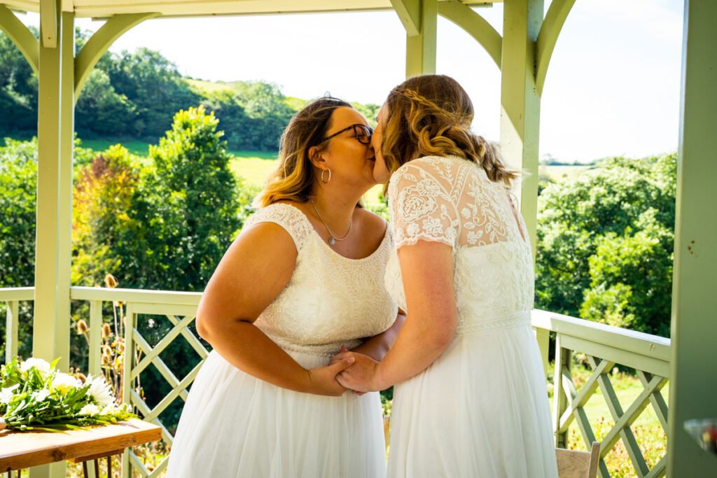 bride and bride 1st kiss at Pengenna Manor Cornwall