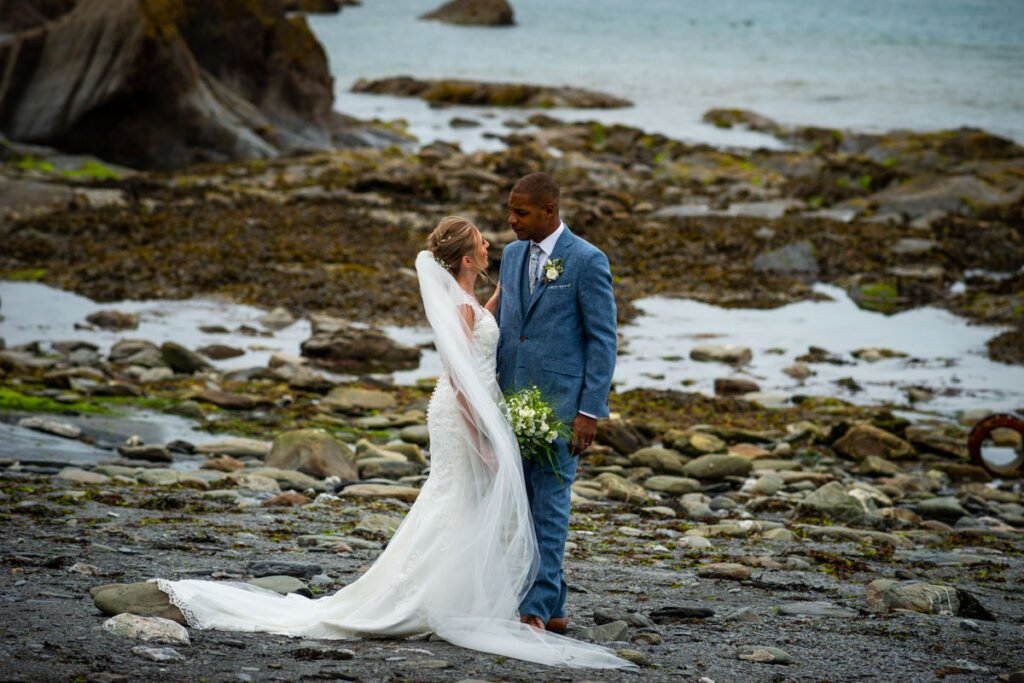 Bride and Groom by the sea pool at Tunnels beaches Ilfracombe Devon