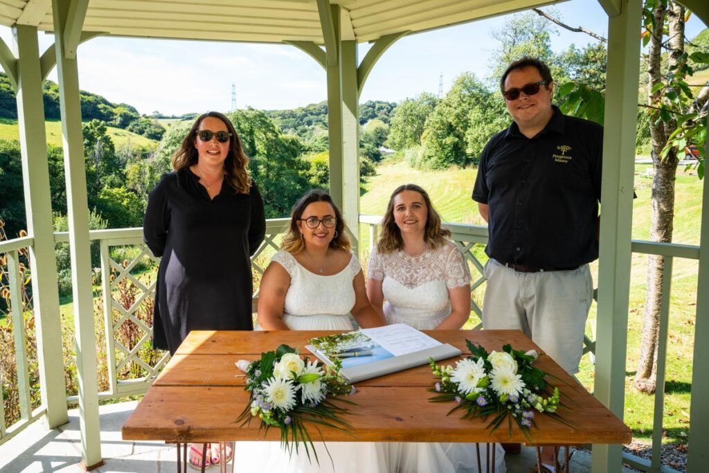 bride and bride and witnesses at Pengenna Manor Cornwall