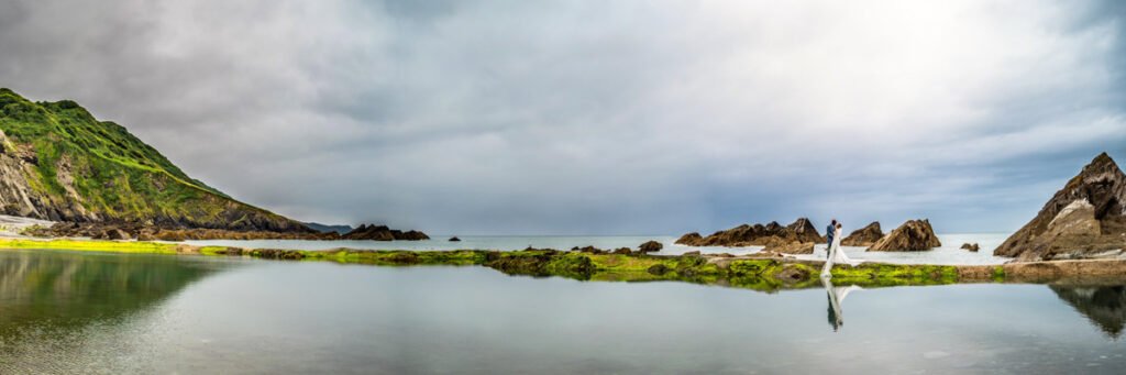 Bride and Groom by the sea pool at Tunnels beaches Ilfracombe Devon