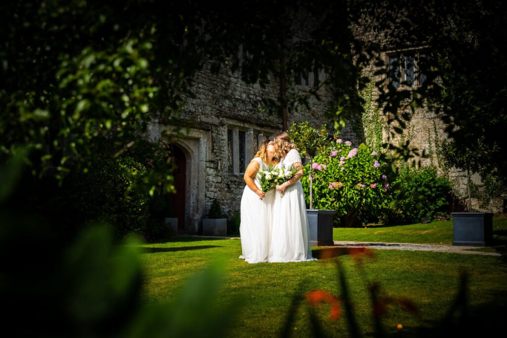 bride and bride in the garden at Pengenna Manor Cornwall