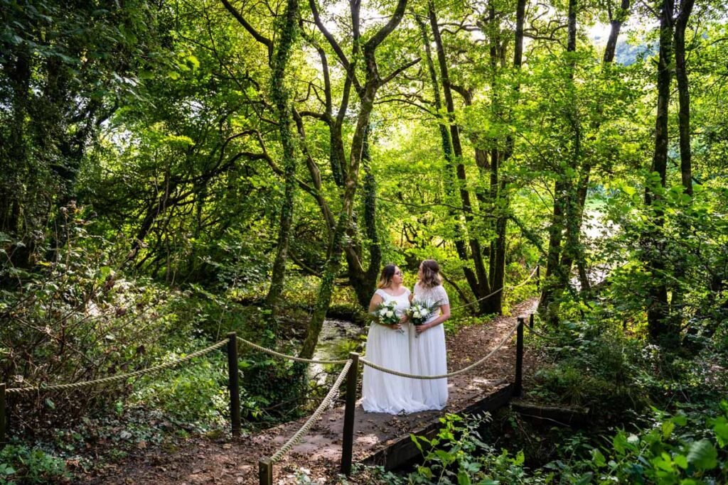 bride and bride in the woods at Pengenna Manor Cornwall