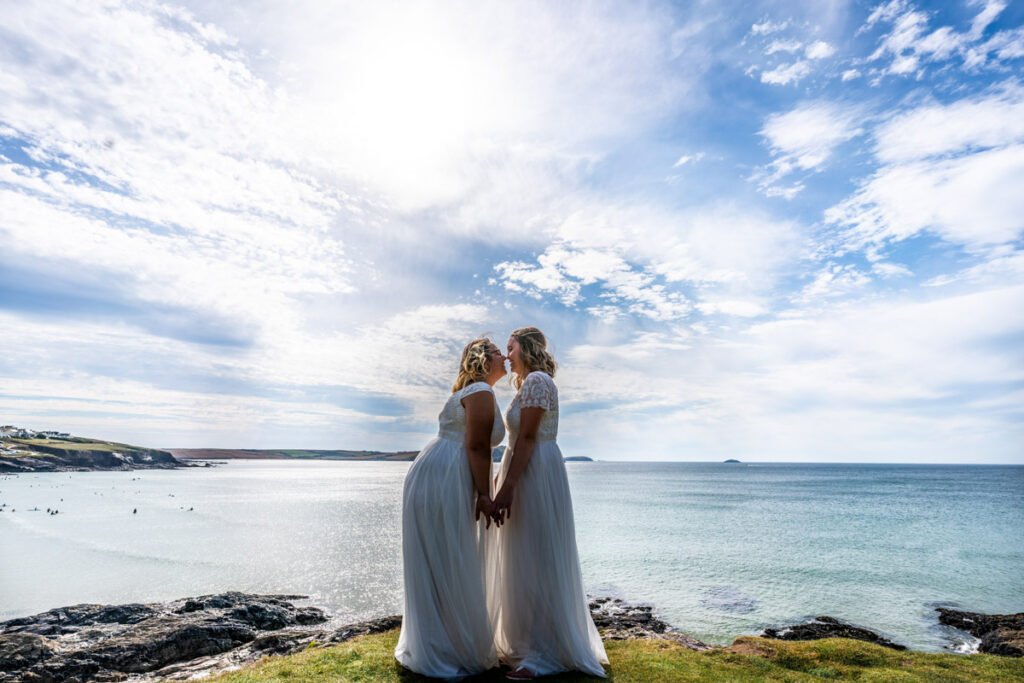 bride and bride at Polzeath beach Cornwall