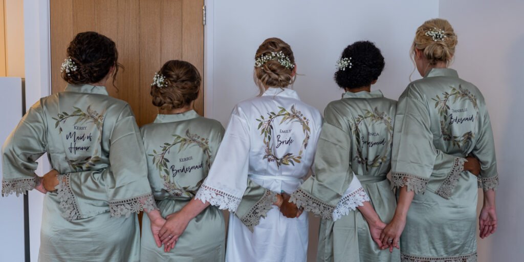 bride and bridesmaids in matching dressing gowns