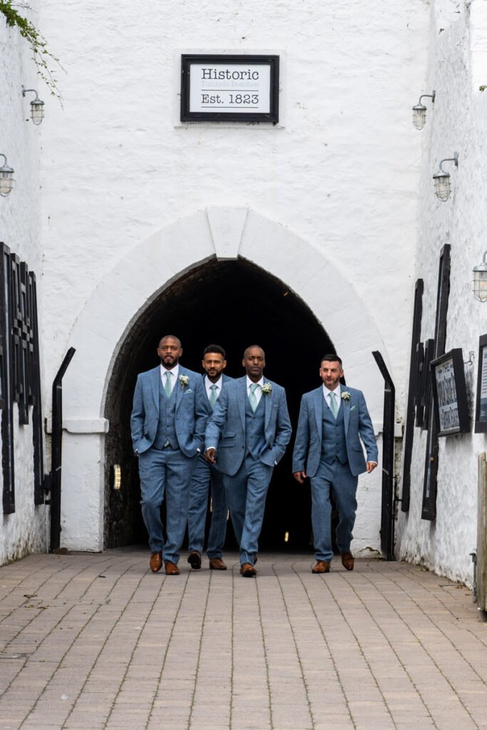 groomsmen arriving at Tunnels beaches Ilfracombe Devon