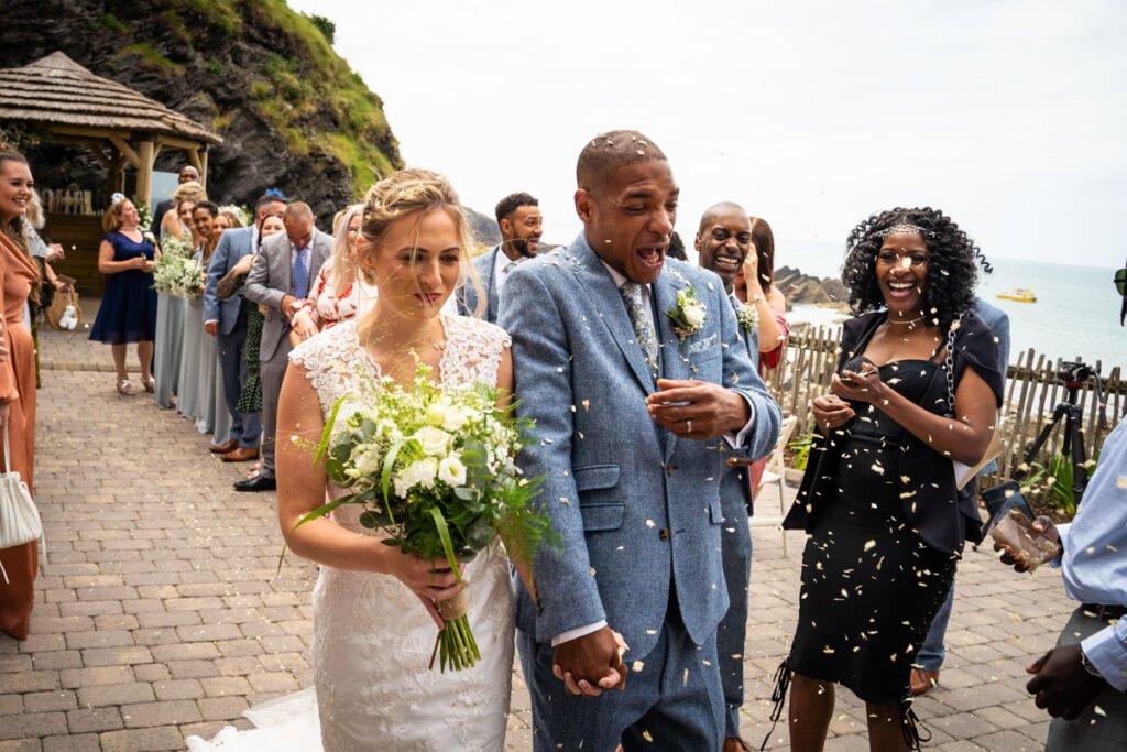 Bride and groom confetti shot at Tunnels beaches Ilfracombe Devon