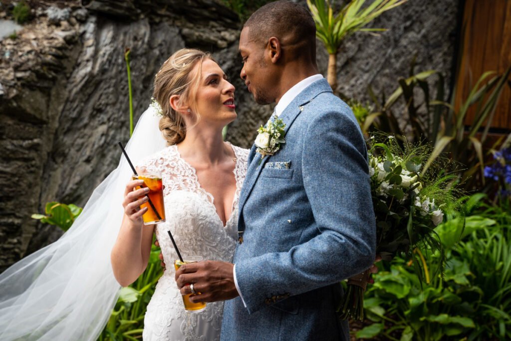 Bride and groom embrace at Tunnels beaches Ilfracombe Devon