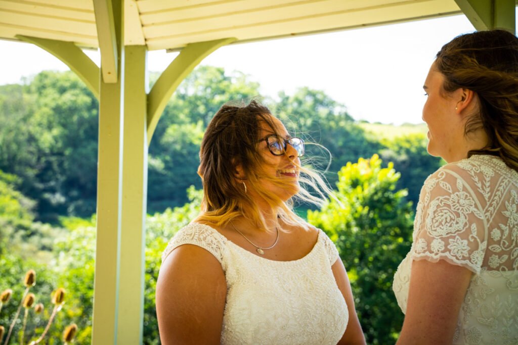 bride and bride during the outdoor ceremony at Pengenna Manor Cornwall