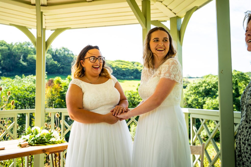 bride and bride during the outdoor ceremony at Pengenna Manor Cornwall
