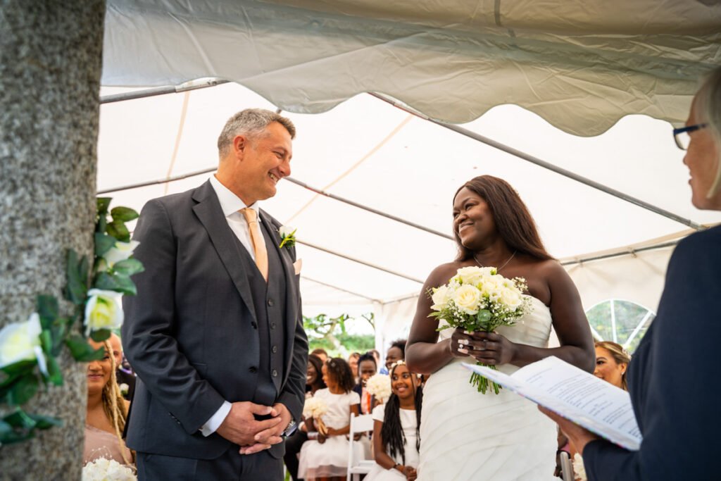 bride and groom vows at glebe farm cottages devon wedding venue