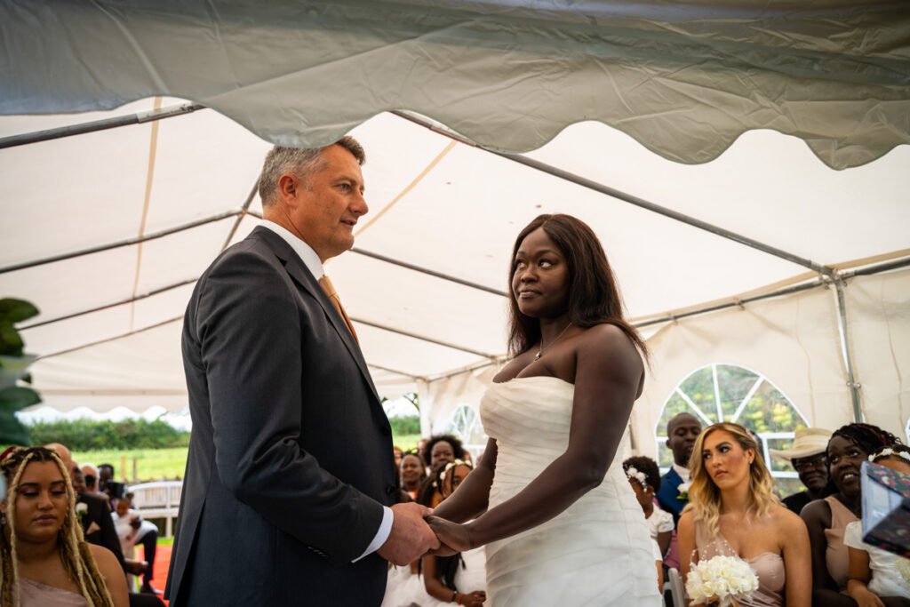 bride and groom vows at glebe farm cottages devon wedding venue