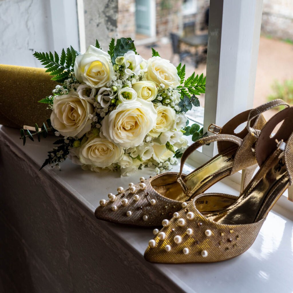 wedding shoes and brides bouquet