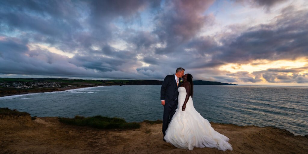 bride and groom sunset shot at Widemouth bay Cornwall