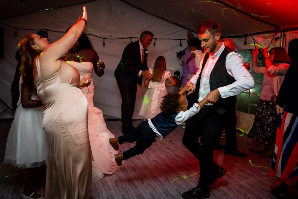 guests dancing at the reception glebe farm cottages wedding venue devon