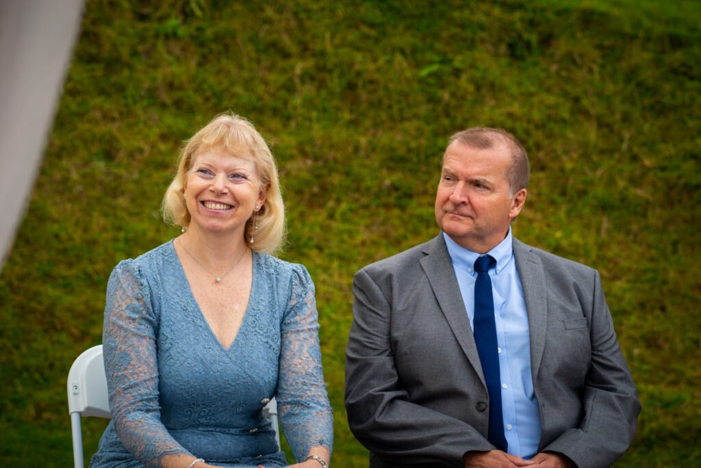 brides parents during the ceremony at devon wedding venue The Sandy cove hotel