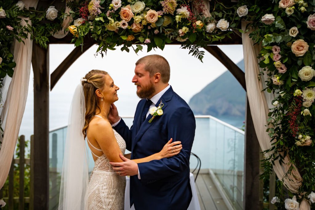 bride and groom wedding ceremony at devon wedding venue The Sandy cove hotel