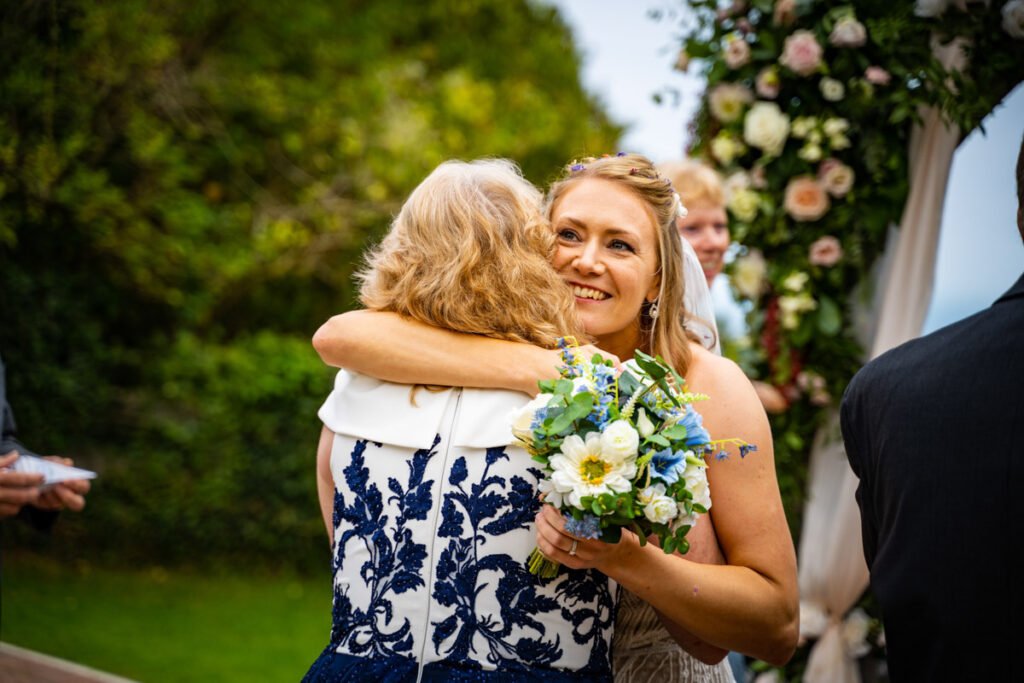 bride and Mum embrace