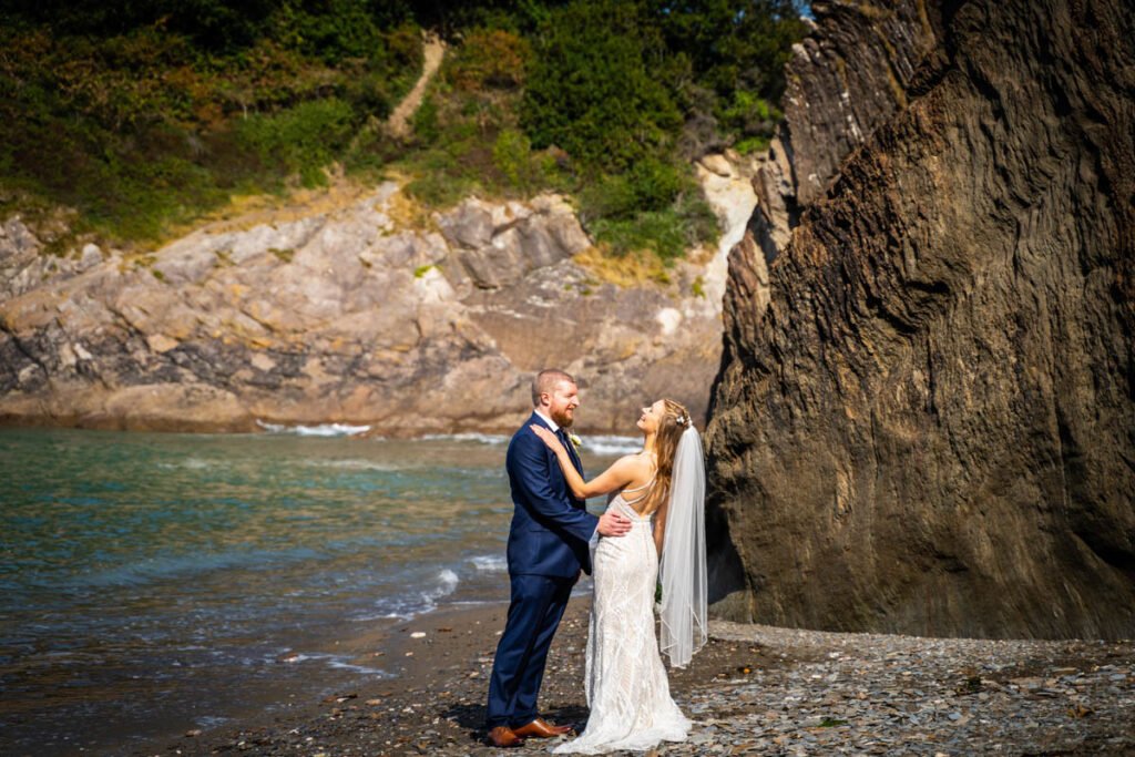 bride and groom on the beach at devon wedding venue The Sandy cove hotel