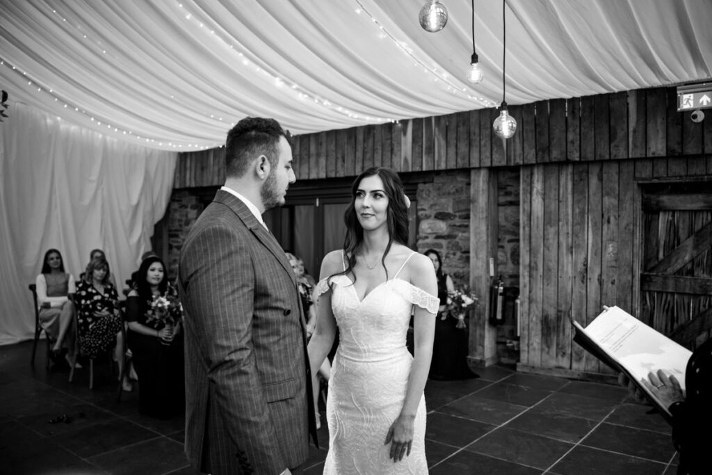 bride and groom vows at Trevenna Barns Cornwall B&W