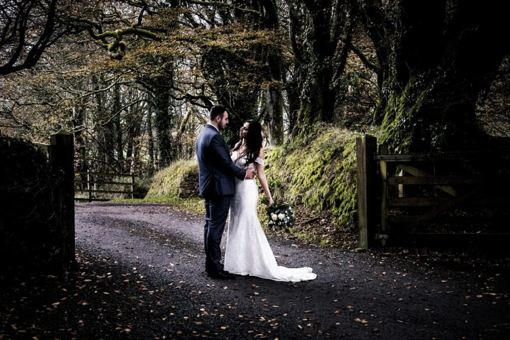 Bride and groom autumn trees at Trevenna Barns Cornwall modern antique