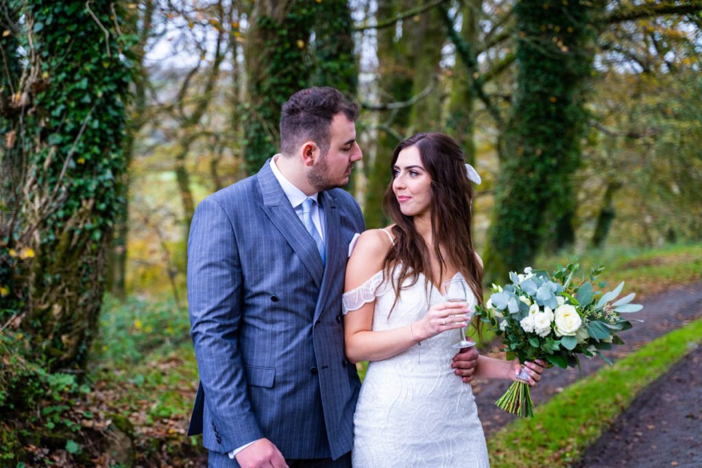 Bride and groom in the woods at Trevenna Barns Cornwall