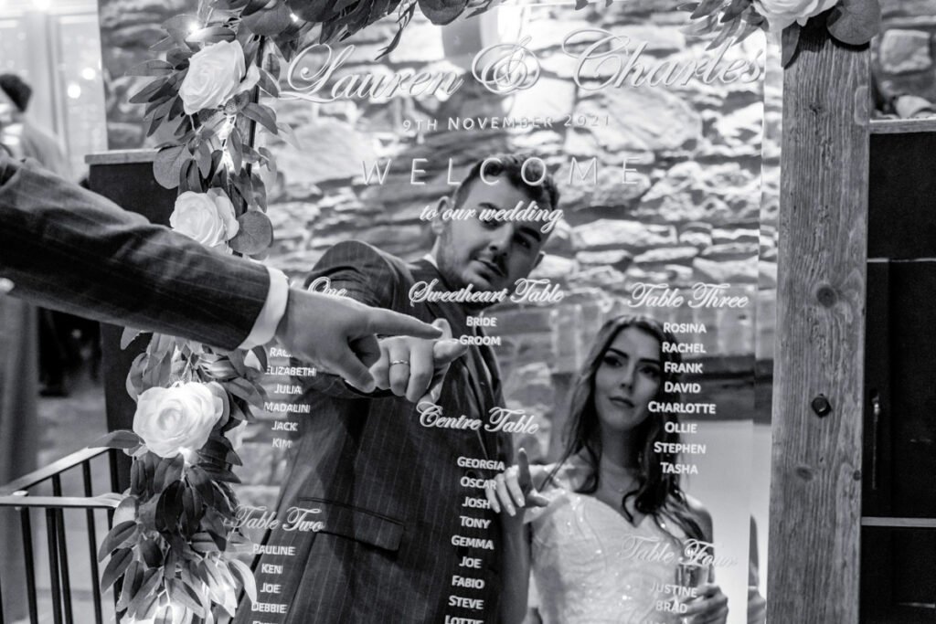 bride and groom in reflection in the mirror at Trevenna barns wedding cornwall