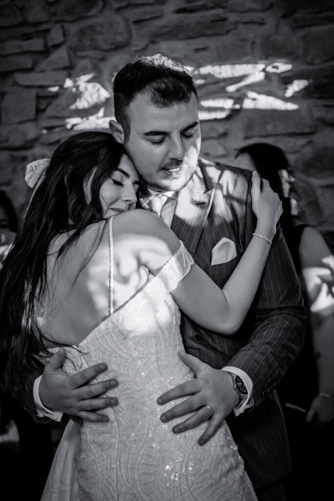 Bride and Groom dancing at Trevenna Barns B&W