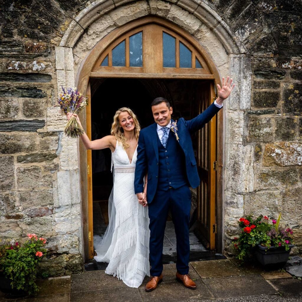 bride and groom portrait at the church doorway