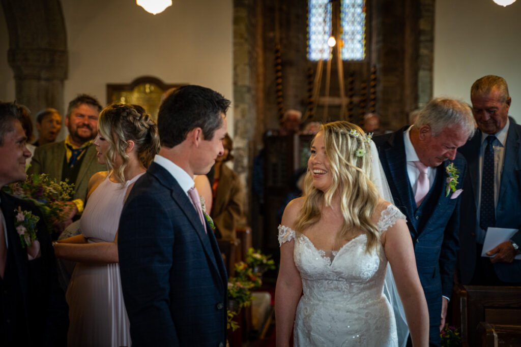 bride and groom laughing at a wedding ceremony in cornwall