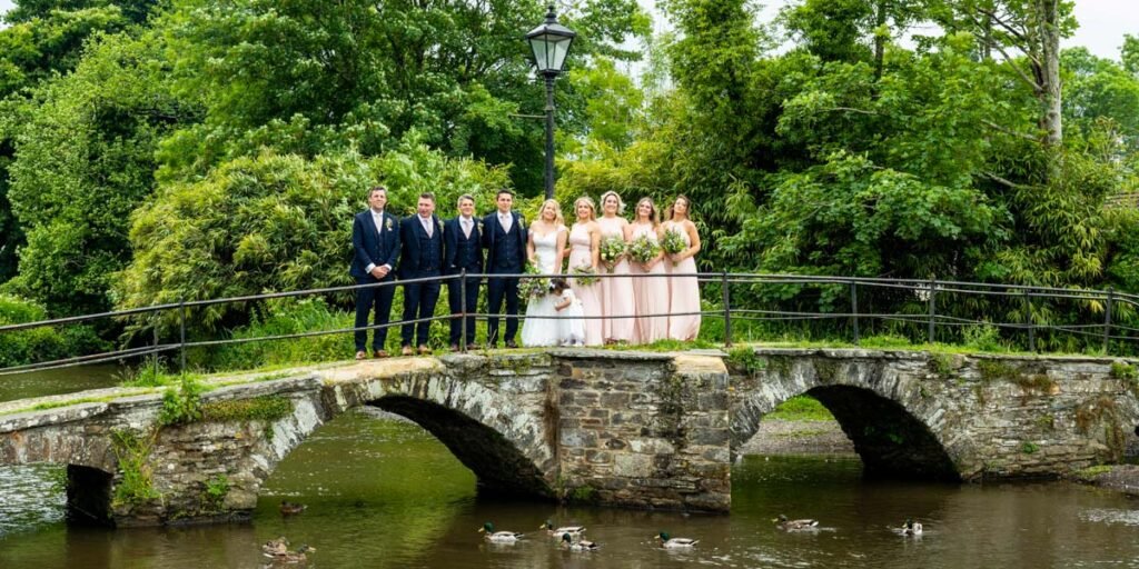 bridal party on the bridge in Launceston cornwall