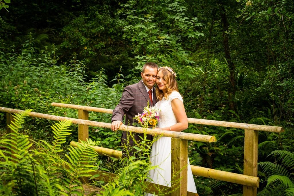 bride and groom on a bridge at cornish tipis in cornwall