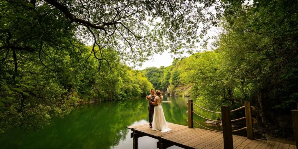 bride and groom portrait overlooking the lake at cornish tipis in cornwall